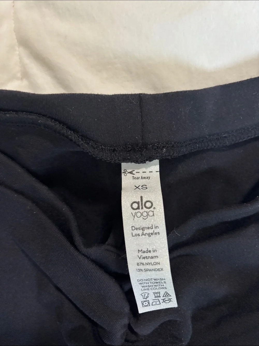 ALO Yoga Black Flare Leggings with Twist Waist